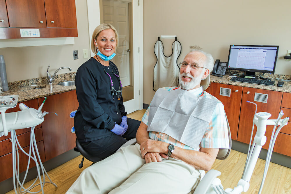 Dr. Green examining a young child's teeth for preventative care